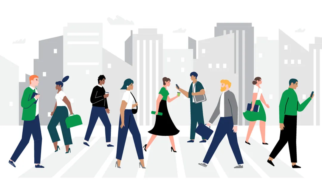 Diverse people walking on a city street, engaged with phones